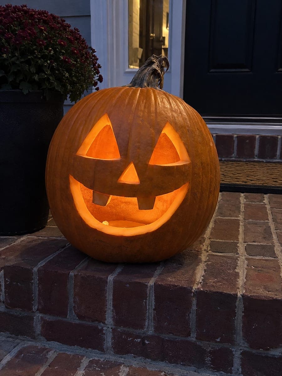 Classic Two-Tooth Jack-O-Lantern on Brick Front Steps