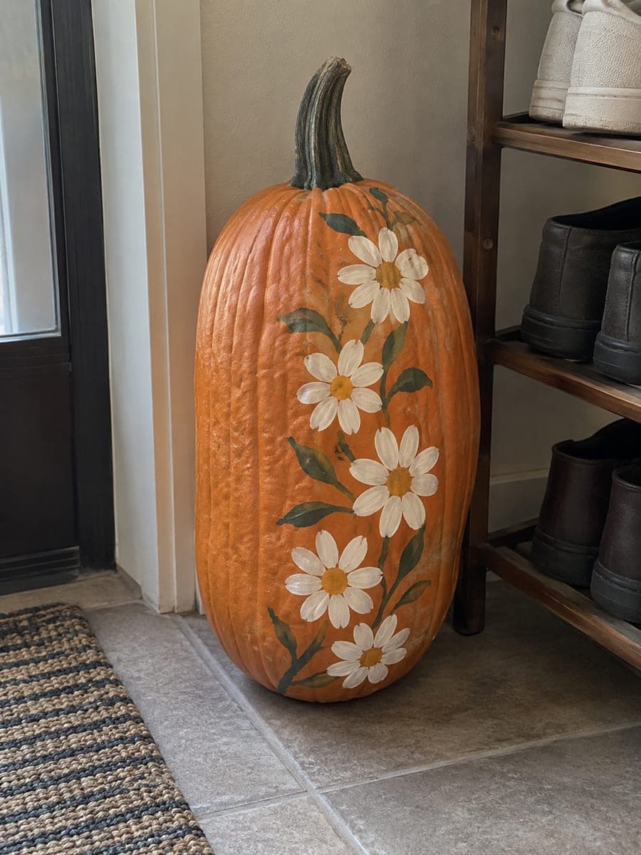 Climbing Daisy Vine Painted Tall Pumpkin in an Entryway