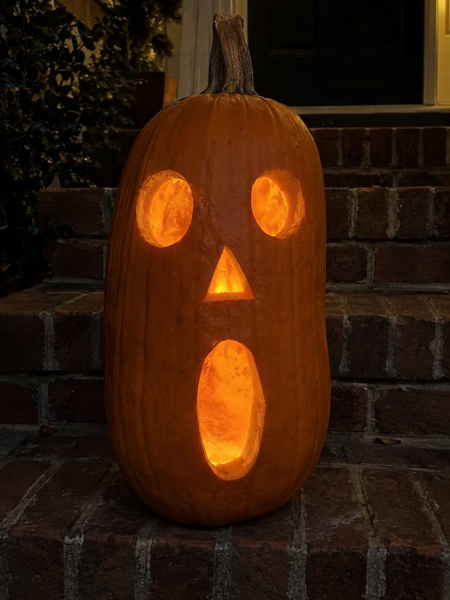 Four-Hole Classic Face Long Pumpkin on Brick Steps