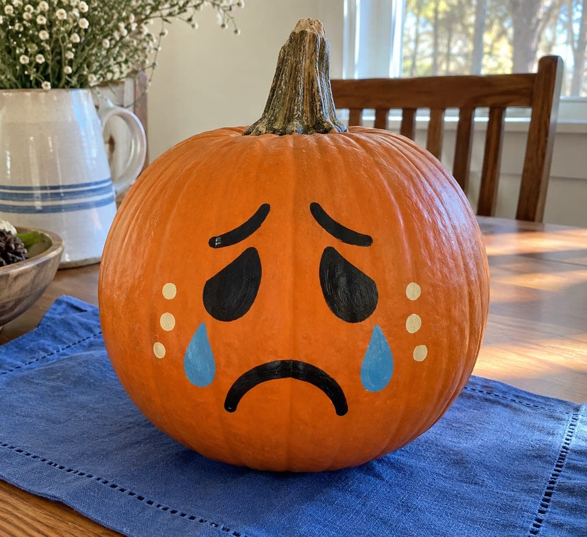 Painted Sad Pumpkin With Blue Teardrop Accents