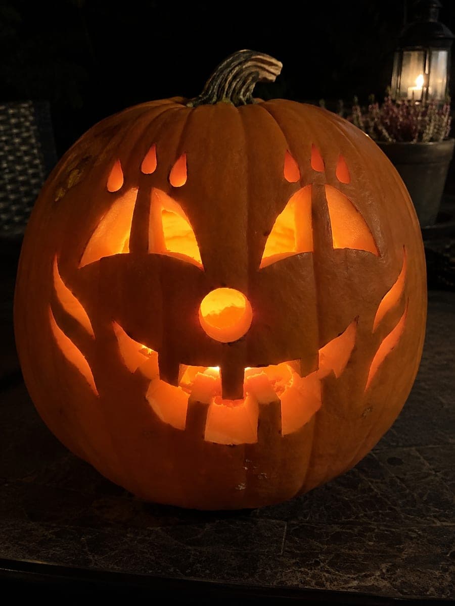 Spooky Clown Pumpkin with Teardrop Brows and Crooked Grin