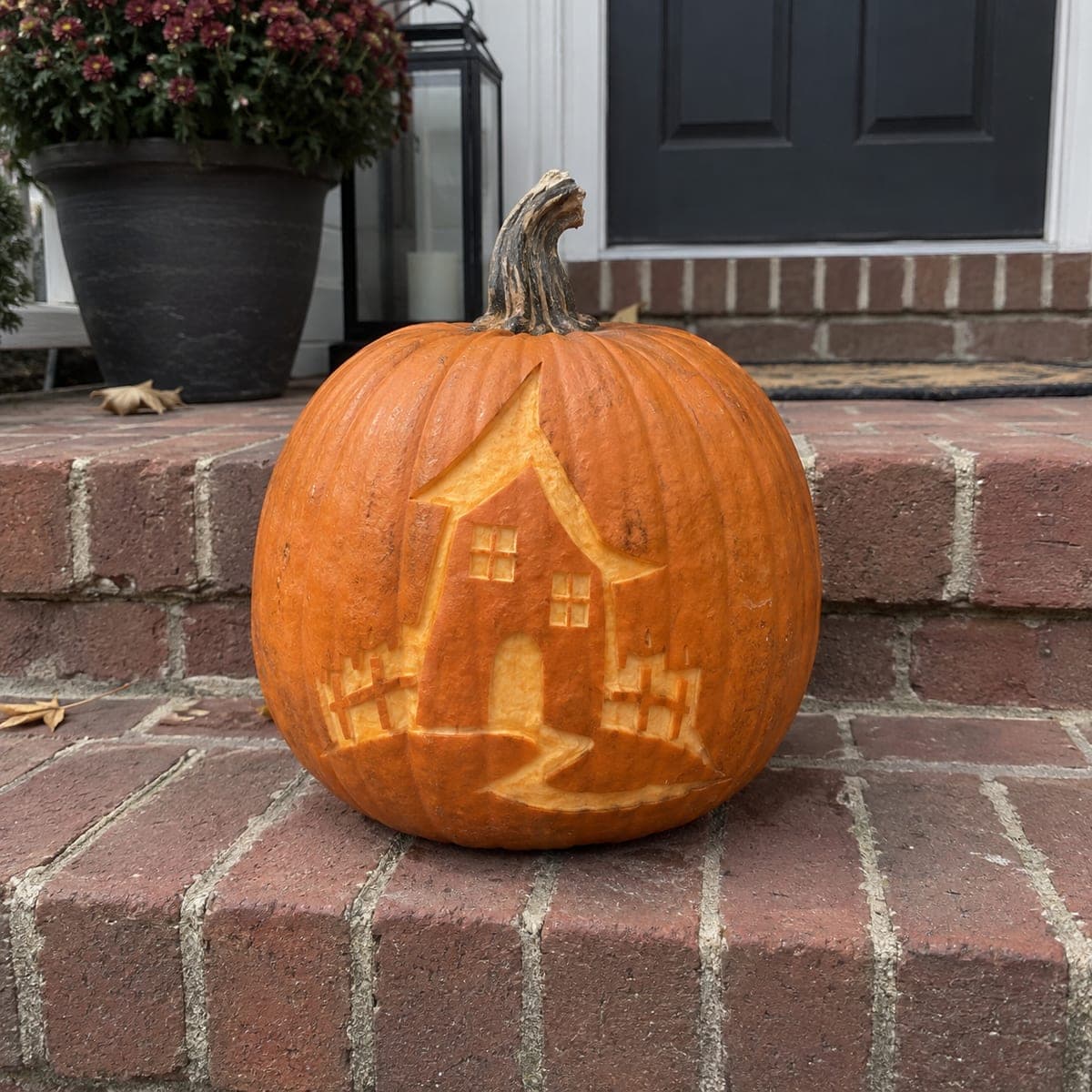 Haunted House Pumpkin Etched on the Front Steps