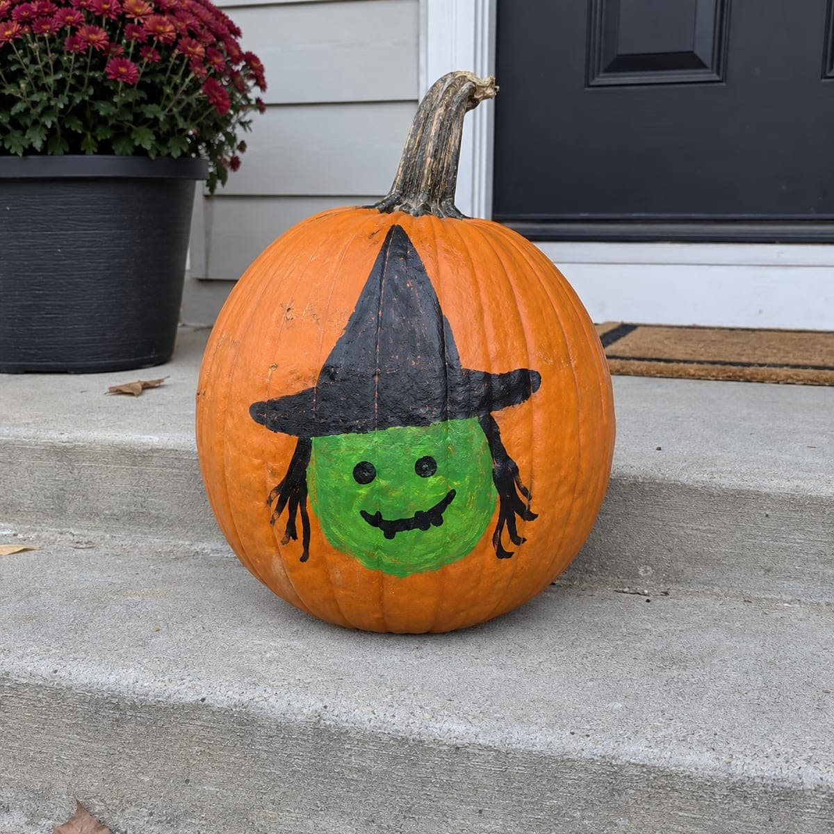 Friendly Green Witch Face Painted Pumpkin