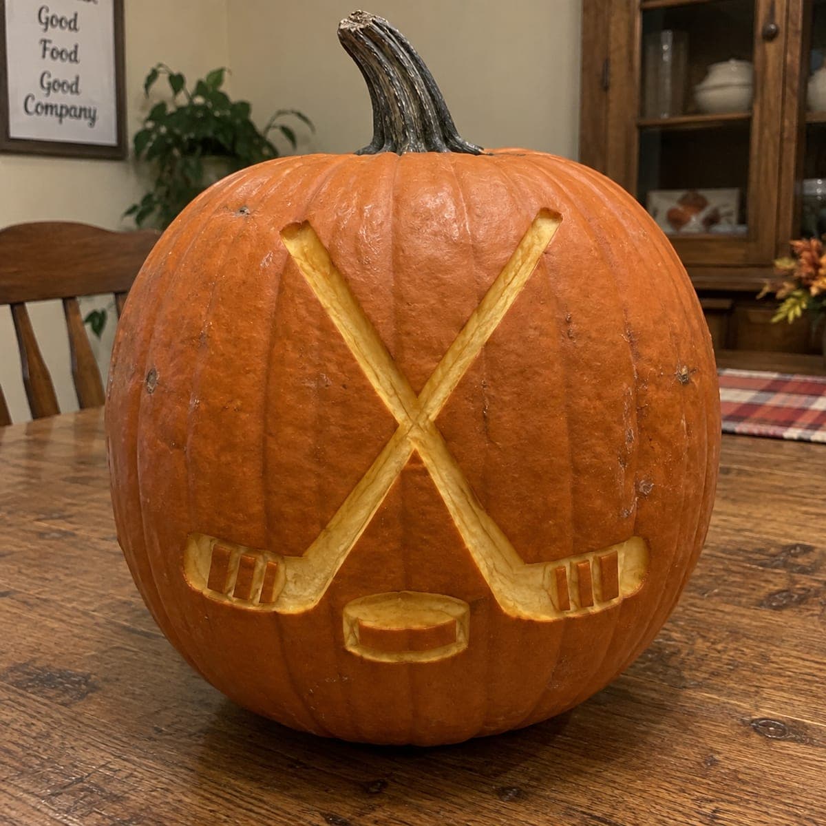 Crossed Hockey Sticks and Puck Etched Pumpkin